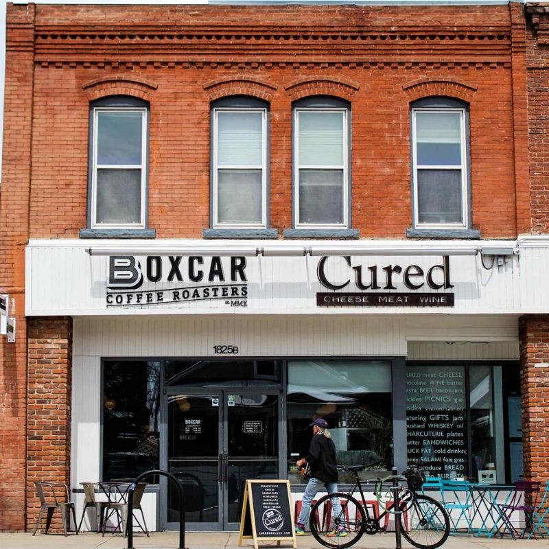 Boxcar Coffee Roasters cafe outside with person walking in