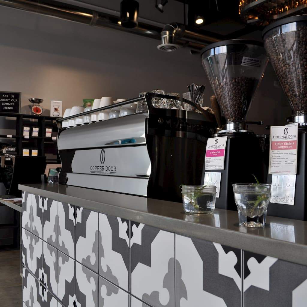 Copper Door Coffee Roasters with espresso machine and grinders