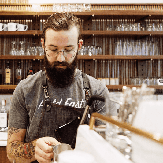 Loyal Coffee cafe barista making a coffee drink