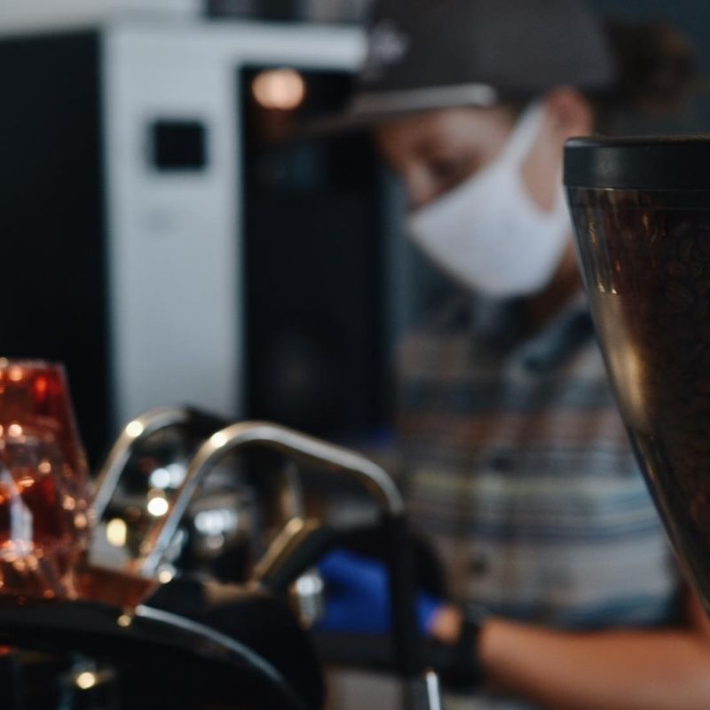 Unravel Coffee barista making a coffee drink