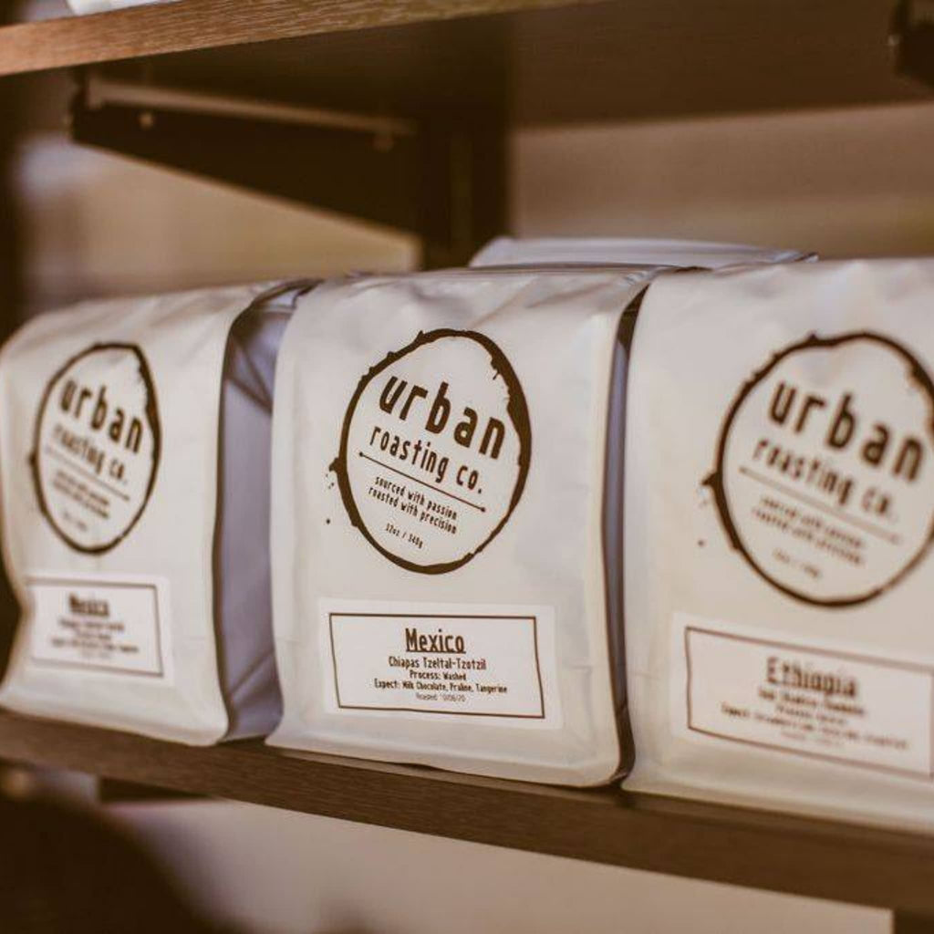 Bags of coffee on a shelf at Urban Steam